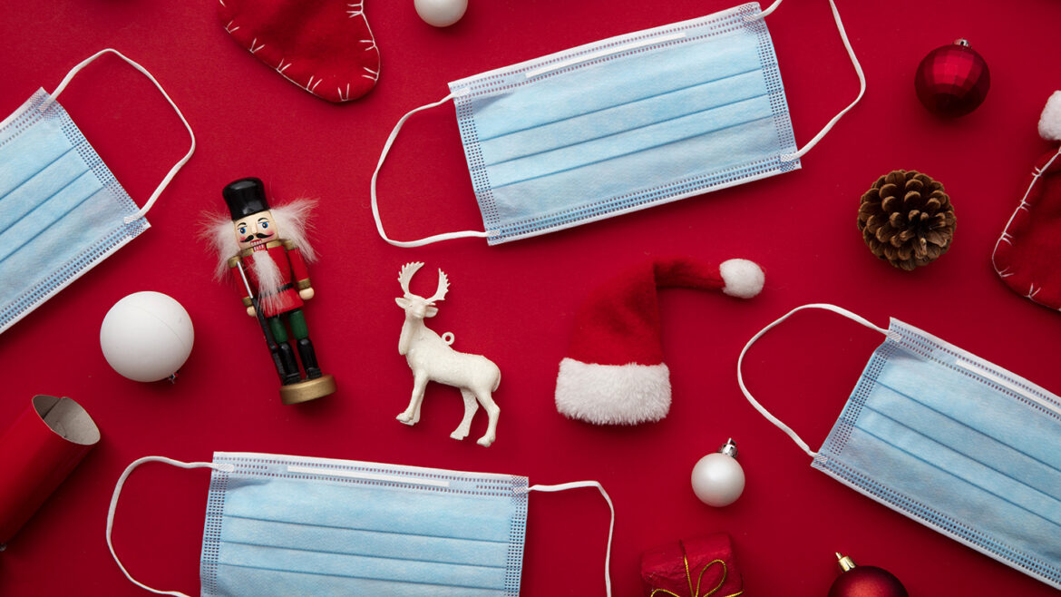 Coronavirus Christmas background. Face mask and festive decorations